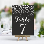 Silver Confetti Elegante Schwarze Tischnummer<br><div class="desc">Fügen Sie Ihrer Hochzeitsfeier eine Touch Glamour hinzu und lassen Sie sich von diesen eleganten Tischnummern verzaubern. Mit einem fett schwarzen Hintergrund und einer Kaskade silberner Konfetti schaffen diese Karten einen modernen und schicken Look. Persönlich mit Ihren Tischnummern für eine gemütliche und unvergessliche Tischumgebung.</div>