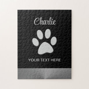 Silver Dog Paw auf schwarzem Hintergrund Puzzle