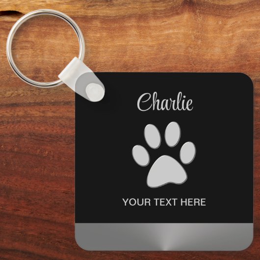 Silver Dog Paw auf schwarzem Hintergrund Schlüsselanhänger (Vorderseite)