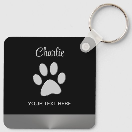 Silver Dog Paw auf schwarzem Hintergrund Schlüsselanhänger (Rückseite)
