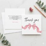 Simple Pink Bow She's Tying the Knot Bridal Shower Dankeskarte<br><div class="desc">Share your appreciation with this simple pink bow “She’s Tying the Knot” bridal shower thank you card, featuring a delicate ribbon bow and elegant script for a soft, feminine look. The minimal design creates a romantic and stylish aesthetic that complements modern, coquette, and chic bridal shower themes. Perfect for sending...</div>