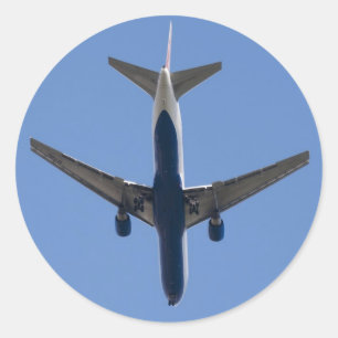 Single-Flugzeug auf blauem Himmel Runder Aufkleber