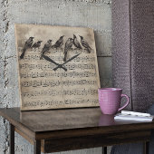 Singvögel auf einer musikalischen Komposition Quadratische Wanduhr