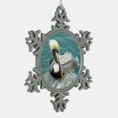 Sitzender Pelikan Schneeflocken Zinn-Ornament (Links)
