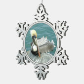 Sitzender Pelikan Schneeflocken Zinn-Ornament (Rechts)