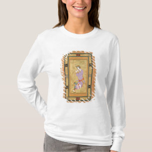 Sitzmädchen, das ihr Haar in ringlets, von t T-Shirt