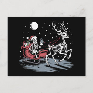 Skelett-Weihnachtsmann fährt mit Schlitten-Rentier Feiertagspostkarte