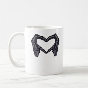 Skeletthandschuhe, die ein Herz bilden Kaffeetasse