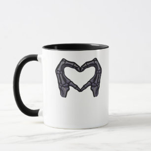 Skeletthandschuhe, die ein Herz bilden Tasse