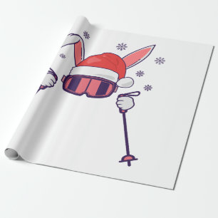 Ski Santa Rabbit mit Weihnachtsmannmütze und Skist Geschenkpapier