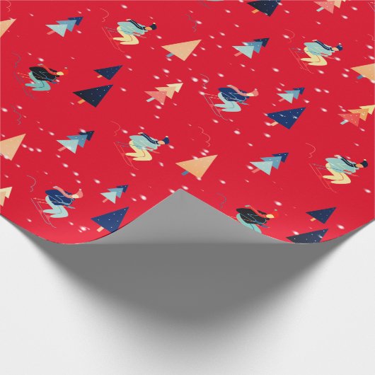 Skifahrer in Schneeflocken auf rotem Papier Geschenkpapier (Ecke)