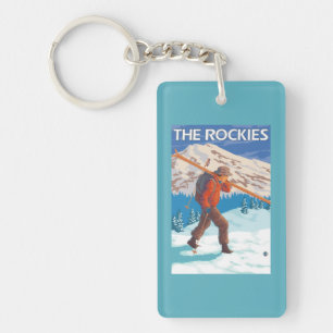 Skifahrer-tragende Schnee-Skis - die Rockies Schlüsselanhänger