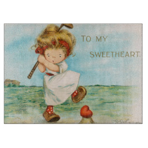 Skurriles kitschiges Golf Valentinstag-Thema, circ Schneidebrett