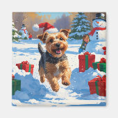Skye Terrier läuft im Schnee mit Weihnachtsmütze Magnet (Vorne)