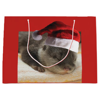 Sleepy Otter mit einem Weihnachtshut Große Geschenktüte