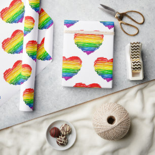 SlipperyJoes regenbogenfarbenes Herz mit kritzelig Geschenkpapier