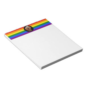 SlipperyJoes Regenbogenflagge mit erhobener Faust Notizblock