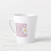 Slogan von Daisy and Peace Makers Milchtasse (Linke Ecke)