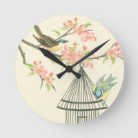 Small Birds Perched on a Branch and on a Birdcage