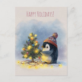 Small penguin decorates tiny Christmas tree, Feiertagspostkarte