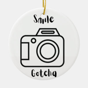 Smile Gotcha mit einer Kamera auf einem Keramik Ornament