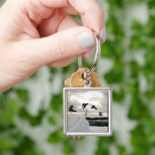 Snowboarding betrügt Schlüsselanhänger (Hand)