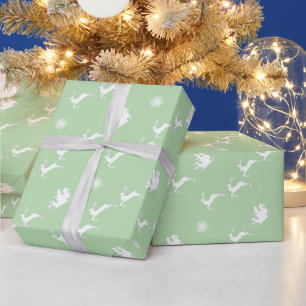 Snowflake und Santa mit Schlitten auf Light Green Geschenkpapier