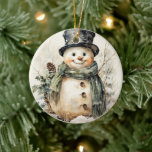 Snowman Christmas Keramik Ornament<br><div class="desc">Fügen Sie mit unserem Snowman Weihnachtsschmuck eine Touch von Launen und Charme hinzu! Dieser bezaubernde Schneemann ist mit einem kräftigen grünen Schal geschmückt, der dem Baum einen Pop festlicher Farbe verleiht. Jedes Ornament wird liebevoll von Hand gefertigt und garantiert eine einzigartige und besondere Touch Ihrer saisonalen Dekoration. Unsere Schneemann-Ornamente sind...</div>