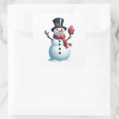 Snowman mit Geschenk Quadratischer Aufkleber (Tasche)