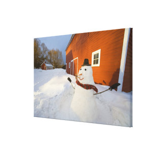 Snowman vor der roten Scheune in Columbia Falls Leinwanddruck