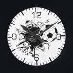 Soccer Ball Busting Out Runde Wanduhr<br><div class="desc">Soccer Ball zeigt bursting out of shirts and merchandise. You can change the background color to your favorite Soccer team and you can personalize.</div>