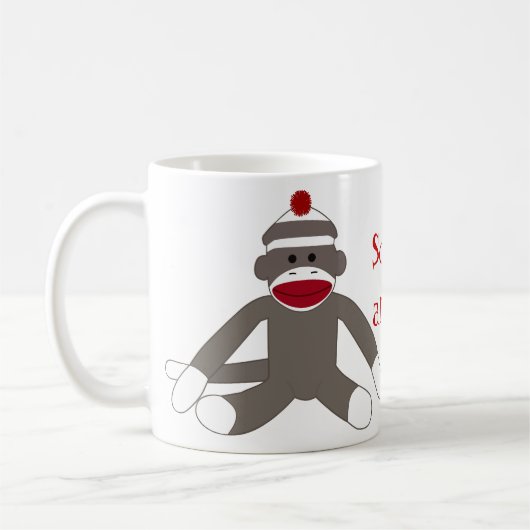 Socke, die herum Monkeying ist Kaffeetasse (Links)