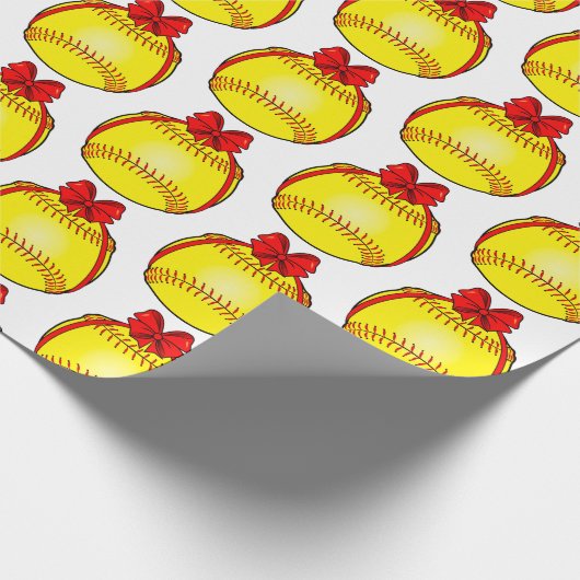 Softball mit einem Weihnachtsbow Geschenkpapier (Ecke)