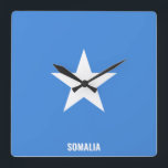 Somalia Flag Dazzling Patriotic Quadratische Wanduhr<br><div class="desc">Somalia Flag Dazzling Patriotic Square Wall Clock in the colors and the elements of the Somalia national flag covering the front of the clock. National flag colors are complemented with the text "Somalia" on the bottom. Text is fully customizable using "Customize it!" feature. Feel free to change it, remove it...</div>