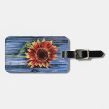 Sonnenblume auf blauem Zaun