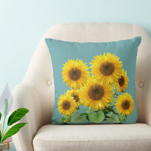 Sonnenblumen auf Türkis erblühen Kissen