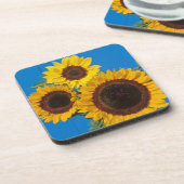 Sonnenblumen gegen blauen Zaun Untersetzer (Linke Seite)