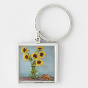 Sonnenblumen in einer Vase auf einem Tisch Schlüsselanhänger