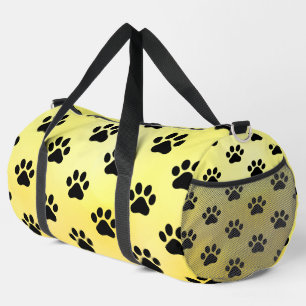 Sonnengelb schwarzer Pfotenabdruck Duffle Bag