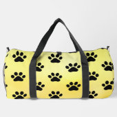 Sonnengelb schwarzer Pfotenabdruck Duffle Bag (Rückseite)