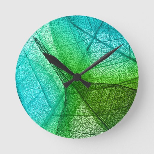 Sonnenlichtfilterung durch transparente Blätter Runde Wanduhr (Vorderseite)