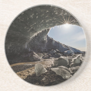 Sonnenstrahlen am Eingang der Eishöhle Untersetzer