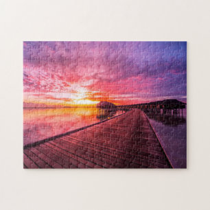 Sonnenuntergang auf Wasser-Landhaus-Erholungsort Puzzle