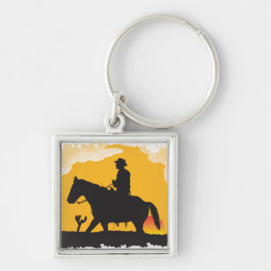 Sonnenuntergang-Cowboy Schlüsselanhänger