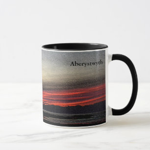 Sonnenuntergang über dem Meer in der Tasse Aberyst