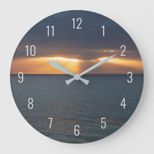 Sonnenuntergang über dem Ozean, der durch die Wol Große Wanduhr