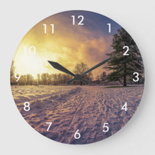 Sonnenuntergang über dem schneebedeckten Winterpar Große Wanduhr