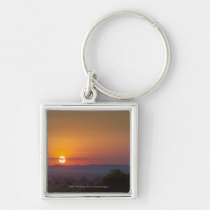 Sonnenuntergang über der afrikanischen Landschaft Schlüsselanhänger