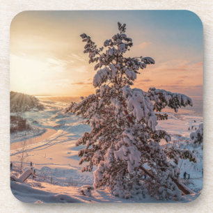 Sonnenuntergang über der schneebedeckten Küste Getränkeuntersetzer