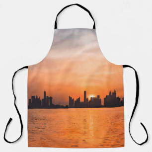 Sonnenuntergang über einer Küstenstadt - Aquarell Schürze